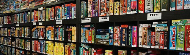 Photo of Boardgames on shelves at Thirsty Meeples board game cafe in Oxford